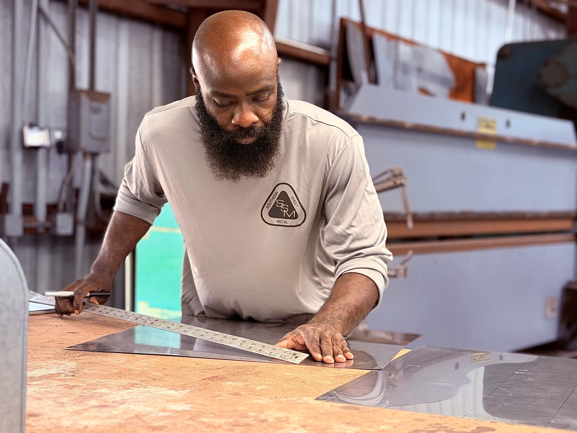 Southern Sheet Metal team member fabricating custom metal components